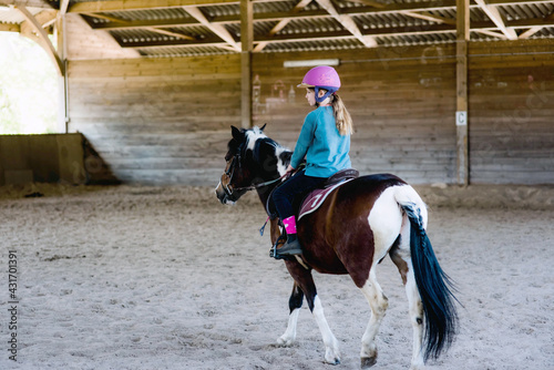 portrait of a young and pretty rider on her pony © Image'in