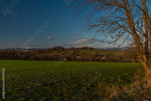 View for Roprachtice village with old church in spring nice sunny evening photo