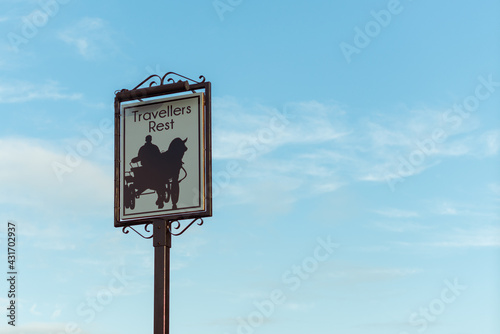 A sign for an old english pub called the travellers rest photo