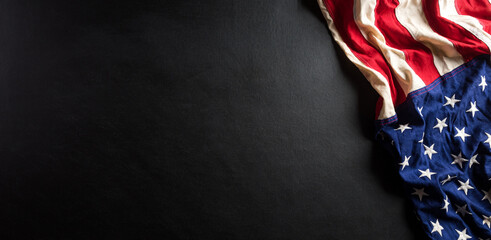 Happy memorial day concept made from american flag with text on black wooden background.