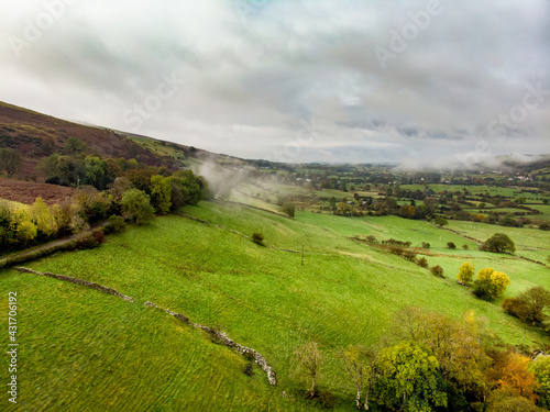 Aerial foggy view of the Lake District, famous for its glacial ribbon lakes and rugged mountains. Popular vacation destination in Cumbria, North West England.