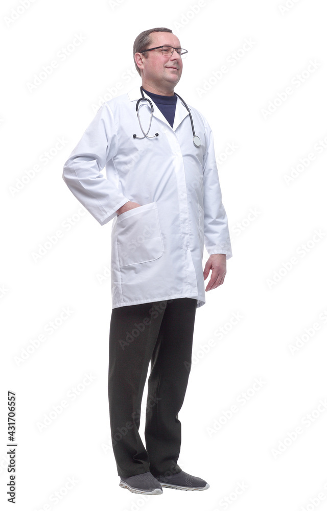 in full growth. friendly male doctor looking at you. in full growth. friendly male doctor looking at you.