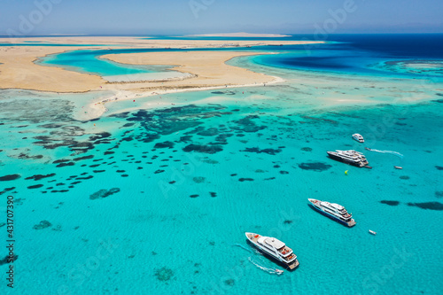 Fototapeta Naklejka Na Ścianę i Meble -  Aerial view: Luxury Yachts in front of Tawila island in the Red Sea, Egypt