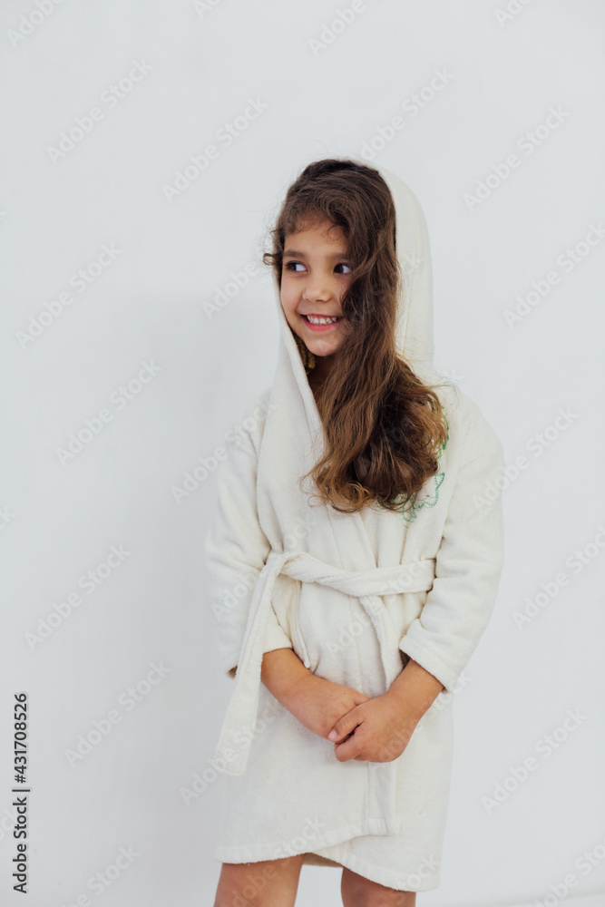 Beautiful little girl in bathrobe after bath Beautiful little girl in bathrobe after bath