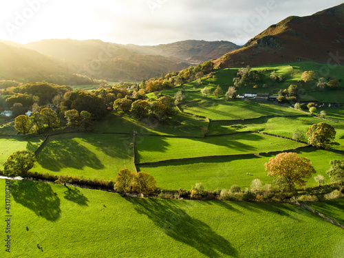 Fotografie Aerial view of endless lush pastures and farmlands of England