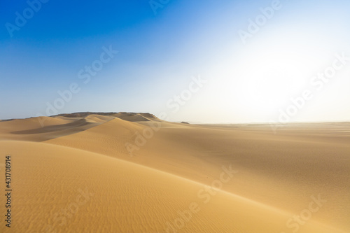 Sahara Desert with perfect blue sky on the background.