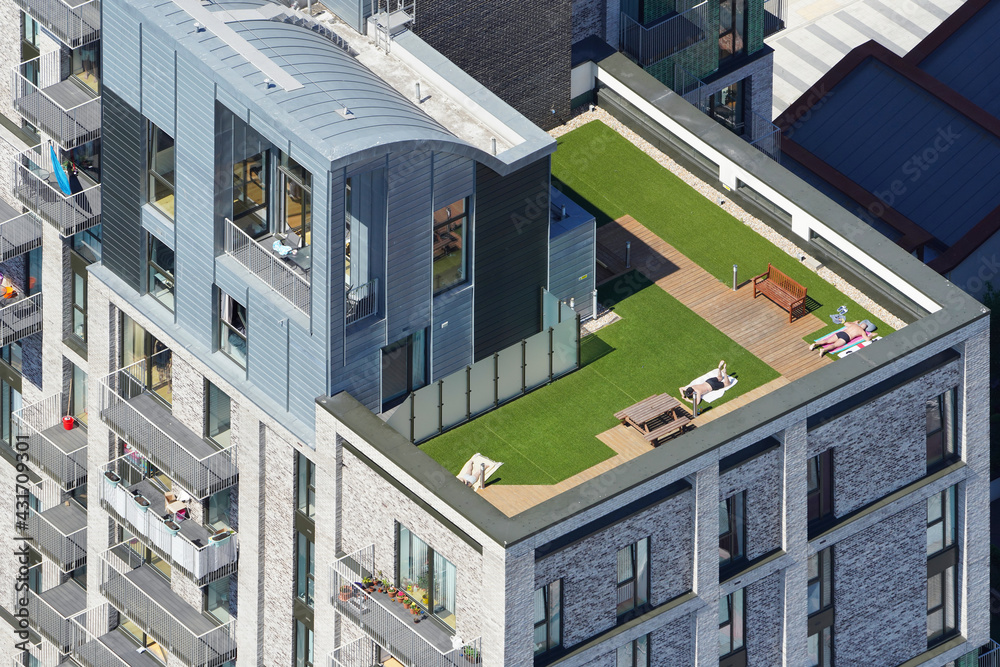 An aerial view taken from a helicopter of a new tower block in central London. The building contains a roof terrace and many flats and homes with balconies looking across the capital city. An aerial view taken from a helicopter of a new tower block in central London. The building contains a roof terrace and many flats and homes with balconies looking across the capital city.