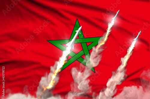 Modern strategic rocket forces concept on flag fabric background, Morocco ballistic warhead attack - military industrial 3D illustration, nuke with flag photo