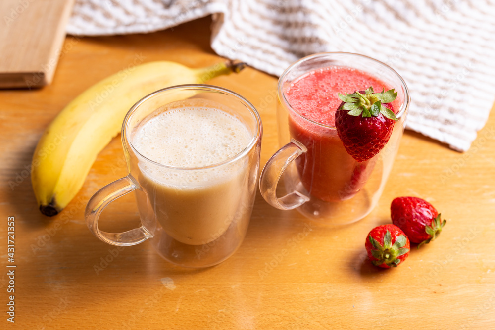 Strawberry and banana smoothie in glass glasses Strawberry and banana smoothie in glass glasses