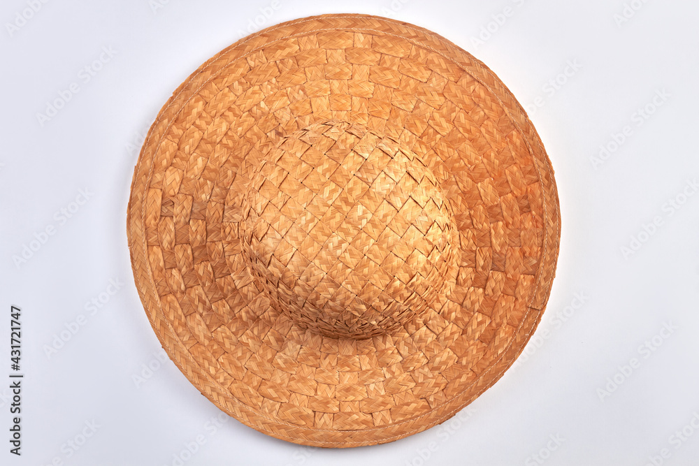 Fototapeta premium Top view of vintage straw hat on white background.