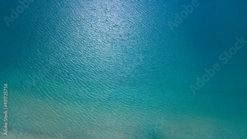 Top view from drone of blue sea in sunny day