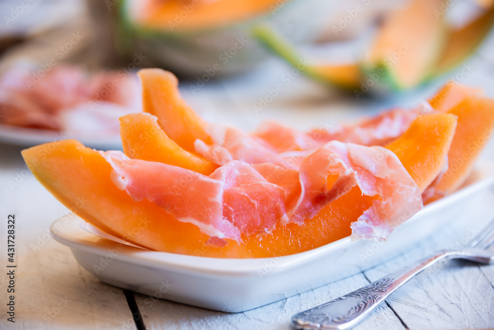 Fresh sweet melon with prosciutto ham, healthy summer food Fresh sweet melon with prosciutto ham, healthy summer food