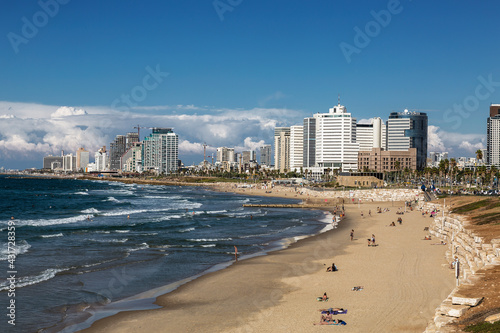 View of Tel Aviv with urban development and people on the beach by the Mediterranean Sea. Israel © vesta48