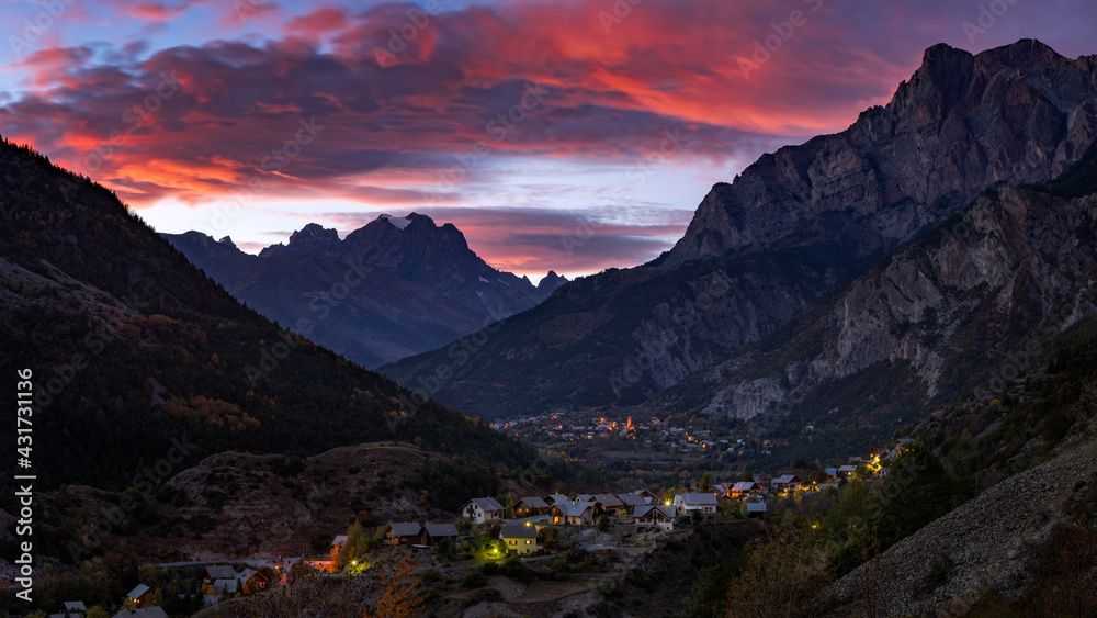Sunset over Mont Pelvoux in the massif of the Ecrins National Park and the village of Les Vigneaux. Vallouise Valley, Hautes-Alpes, French Alps, France