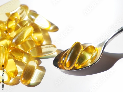 Omega-3 cod liver oil in a white container and with a white background picture.