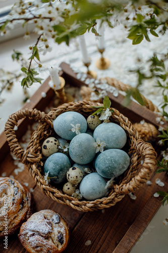 eggs painted blue. Easter eggs top view. chicken and quail eggs in a basket.