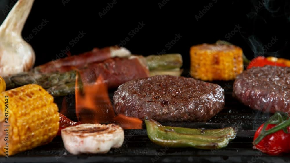 Super slow motion of falling hamburger steak on grill. Filmed on high speed cinema camera, 1000 fps. Super slow motion of falling hamburger steak on grill. Filmed on high speed cinema camera, 1000 fps.