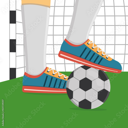 A football player in sports shoes and a soccer ball on the background of a soccer goal.
