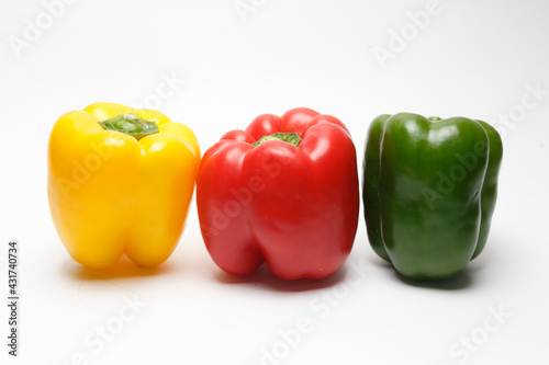 Red yellow green bell pepper isolated on white background