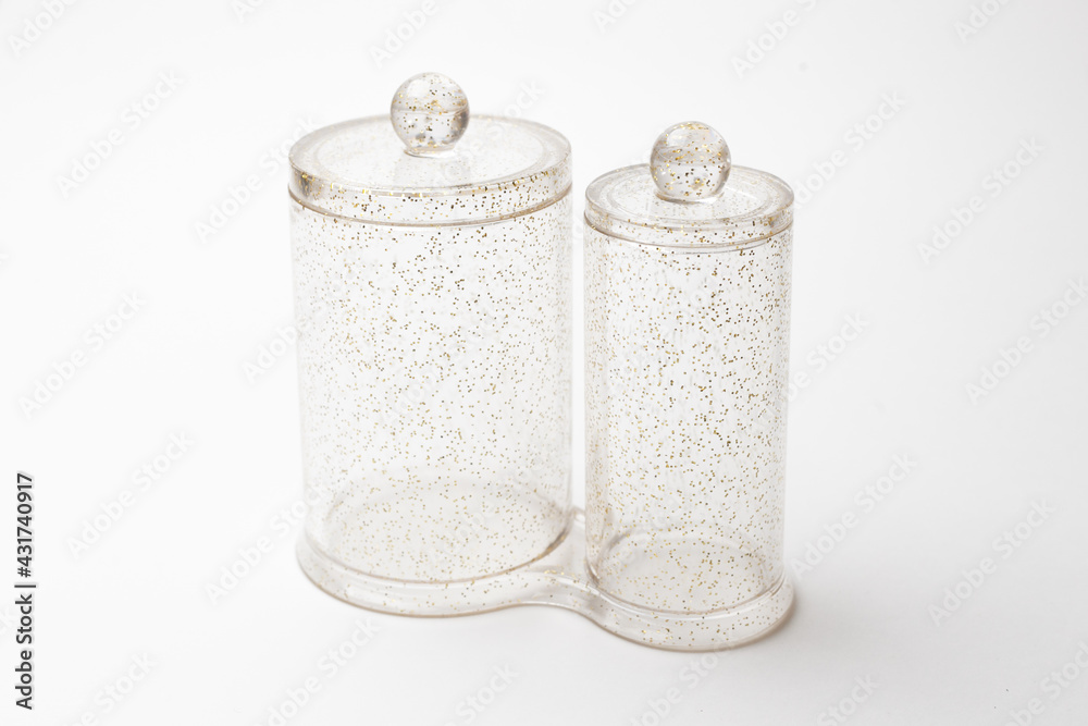 transparent jars with sequins isolated on white background transparent jars with sequins isolated on white background