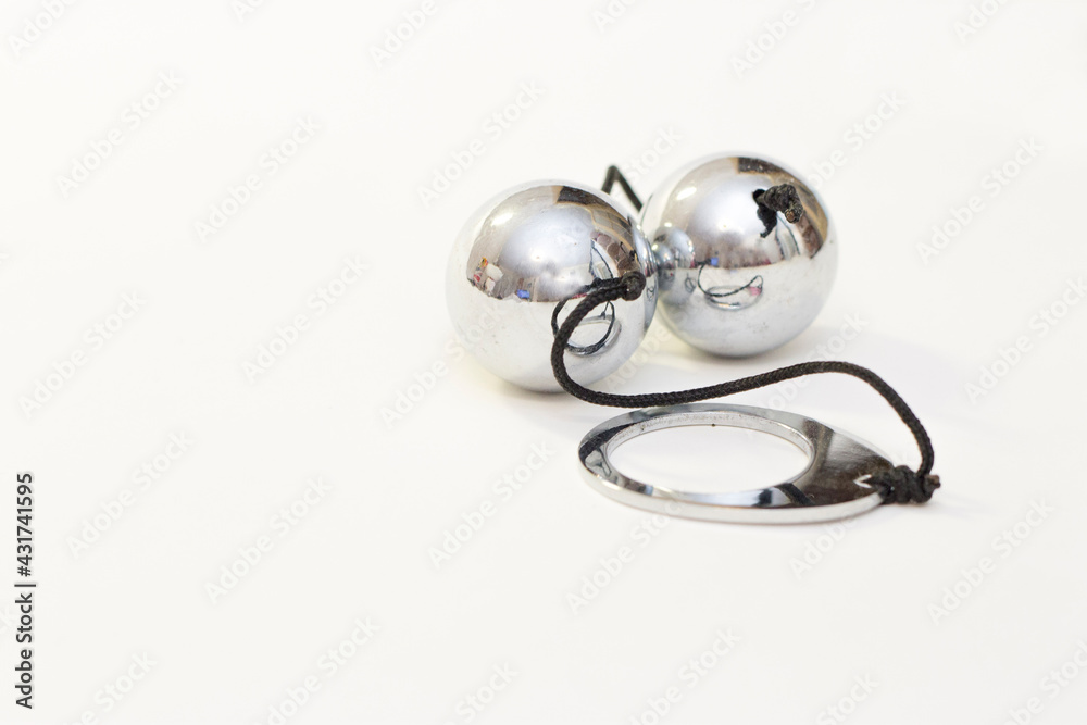 Two vaginal lover balls in chrome isolated on the white background Two vaginal lover balls in chrome isolated on the white background