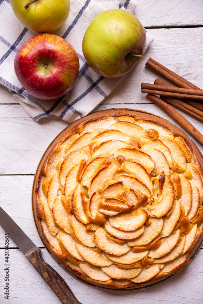 Apple pie, delicious pastry dessert with slices of apple on top Apple pie, delicious pastry dessert with slices of apple on top