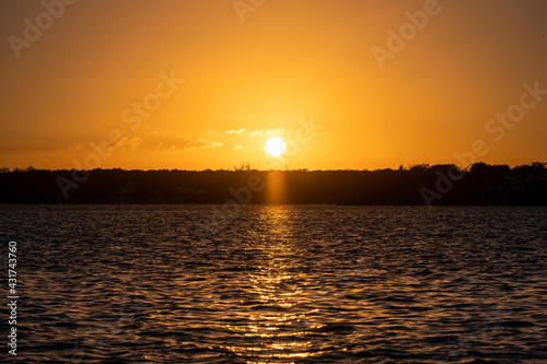 Beautiful sunset over water. Sunset in Bacalar, Mexico.