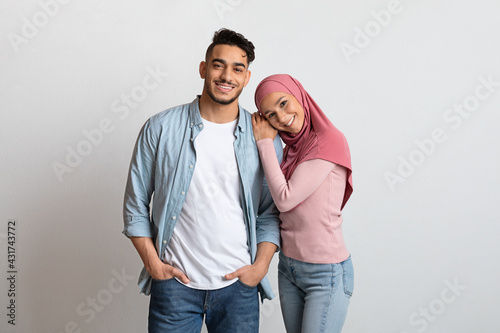 Portrait Of Young Affectionate Arabic Family, Millennial Man And Woman In Hijab
