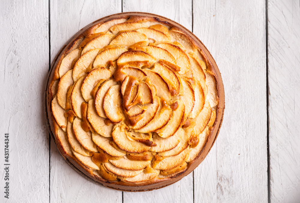 Fototapeta premium Apple pie, delicious pastry dessert with slices of apple on top