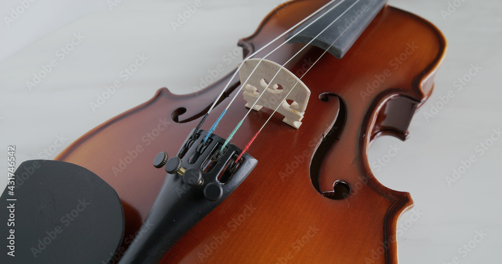 Fototapeta premium Violin string and bridge close up