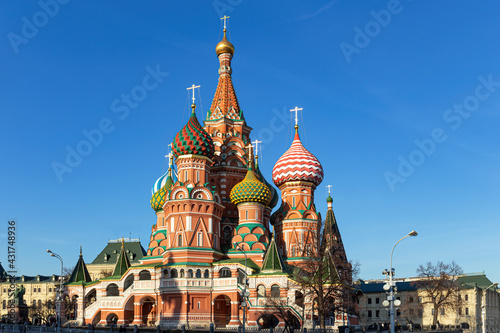 The colorful Cathedral of St. Basil the Blessed with painted domes against the blue sky. Summer sunny day. Moscow, Russia.