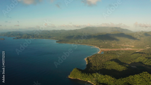 Aerial view coastline of tropical island and sea at sunrise. El nido, Palawan, Philippines. Seascape, island covered with forest in the morning. tropical landscape