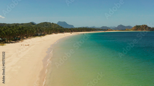 Fototapeta Naklejka Na Ścianę i Meble -  Wide sand beach Nacpan Beach, aerial view. El Nido, Palawan, Philippine Islands. Seascape with tropical beach and islands. Summer and travel vacation concept