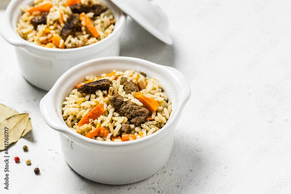 Rice pilaf with orzo and meat in pots. Space for text. Rice pilaf with orzo and meat in pots. Space for text.