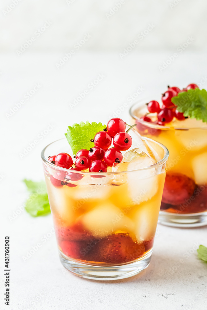 Red currants, summer berry iced tea in glasses. Space fot text. Red currants, summer berry iced tea in glasses. Space fot text.