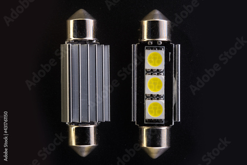 Lot of Car light bulbs emitting diode, accessories and components for electronics vehicles. Modern technologies and low energy consumption concept. Black background close-up view. 12V c5w w5w photo