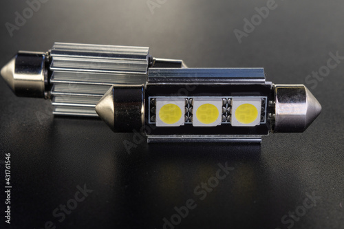 Lot of Car light bulbs emitting diode, accessories and components for electronics vehicles. Modern technologies and low energy consumption concept. Black background close-up view. 12V c5w w5w