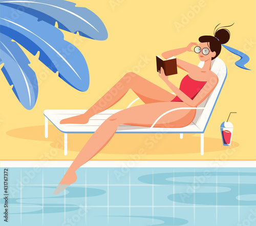 Summer vacation concept. Girl in a red swimsuit reading book by the swimming pool