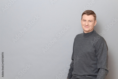 Obraz na plátně Portrait of happy blond mature man smiling cheerfully