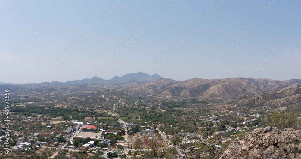 High angle shot of plants and hills on a sunny day in Mixteca Poblana, Puebla, Mexico