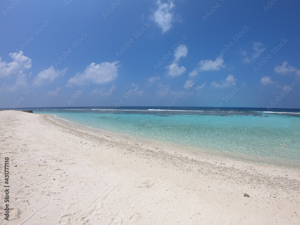 Tropical paradise beach background - clear sea and sand, Maldives