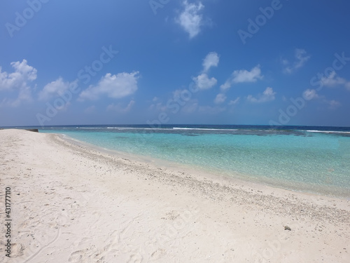 Tropical paradise beach background - clear sea and sand, Maldives