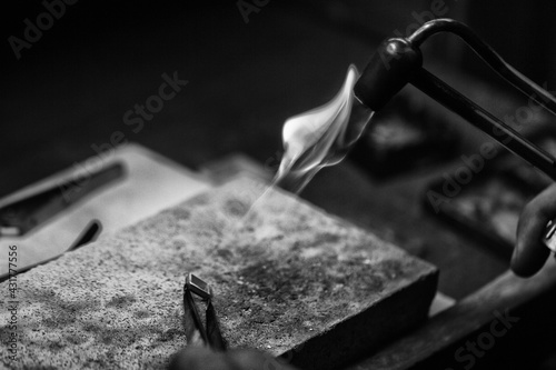 Goldsmith's hands at work, handmade jewelery