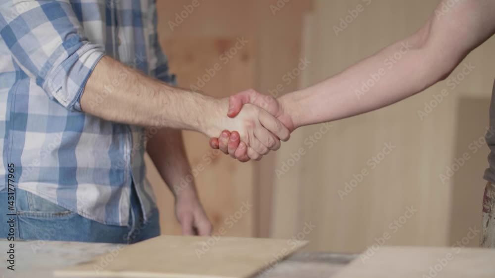 Carpenter made a successful deal with a handshake Carpenter made a successful deal with a handshake