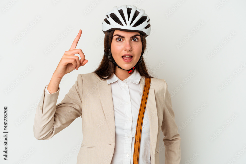 Young caucasian woman riding a bicycle to work isolated on white background having an idea, inspiration concept. Young caucasian woman riding a bicycle to work isolated on white background having an idea, inspiration concept.