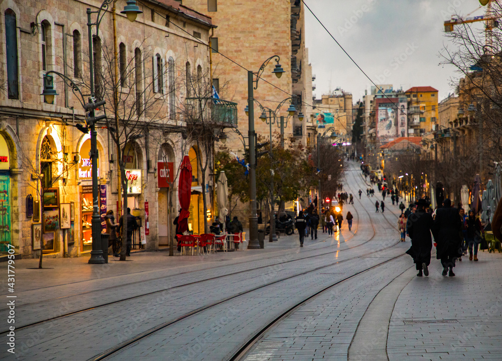 Jerusalem, Israel.  8 January, 2019. Central street of Jerusalem, big houses, tram, people, cafes and shops