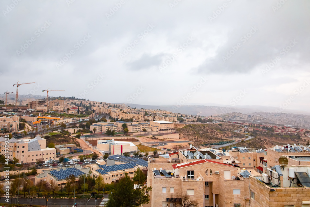 view from the mountain to Jerusalem in cloudy weather. Cars, light stone houses
