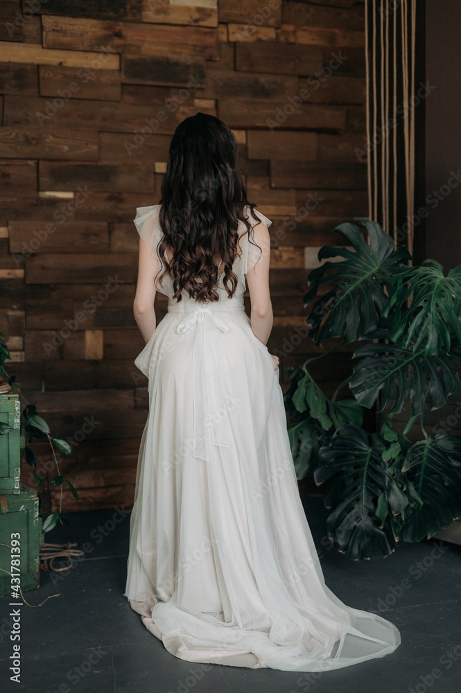 Fototapeta premium Beautiful girl in a light dress. Boho style.