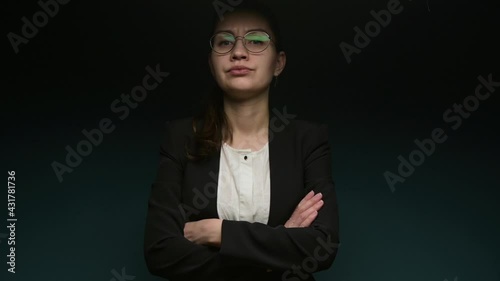 Displeased office executive shakes his head to the side in accusation, arms folded across his chest