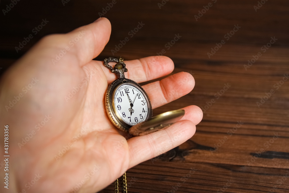 a pocket watch in the hands of a man a pocket watch in the hands of a man